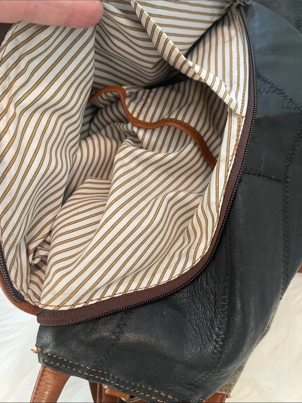 Black Leather Backpack with Brown Trim and Brass Accents